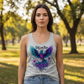Confident brunette in Still We Rise heather gray tank in sunny park