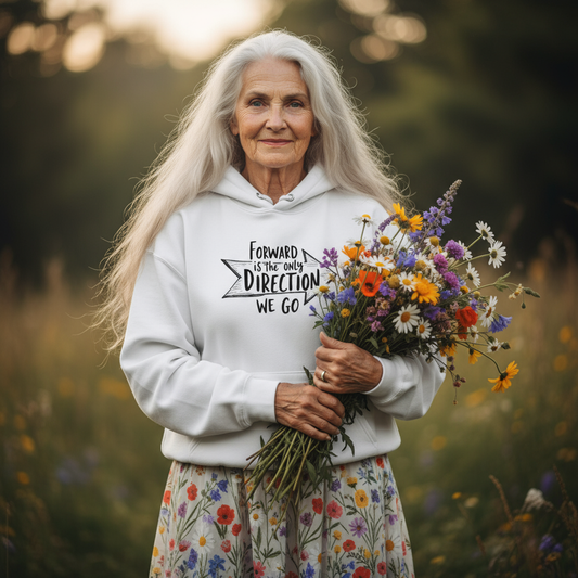 Elderly woman in white Forward hoodie with wildflowers