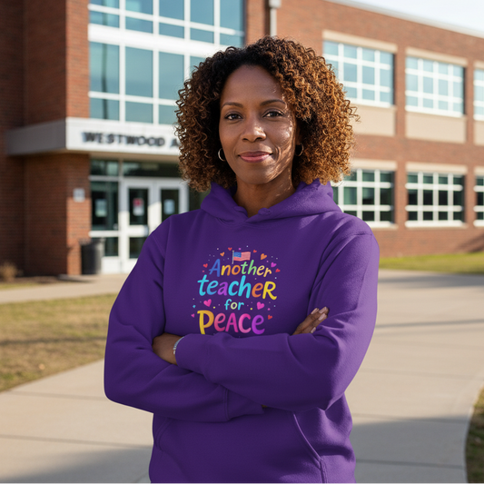 Female principal in Purple Another Teacher for Peace hoodie in front of high school