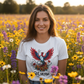 Portrait of woman in Still We Rise protest tee in wildflowers