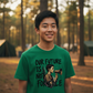 Young Chinese teen in Kelly green tee at Boy Scout camp